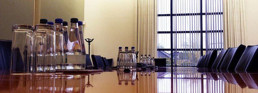 Conference table with water bottles